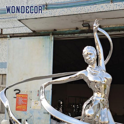 Large stainless steel character shaped outdoor sculpture in the park