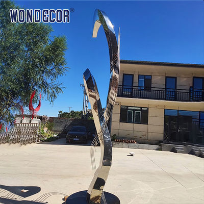 Large rotating stainless steel sculpture outdoor square park